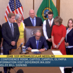 Governor Jay Inslee signing bill into law